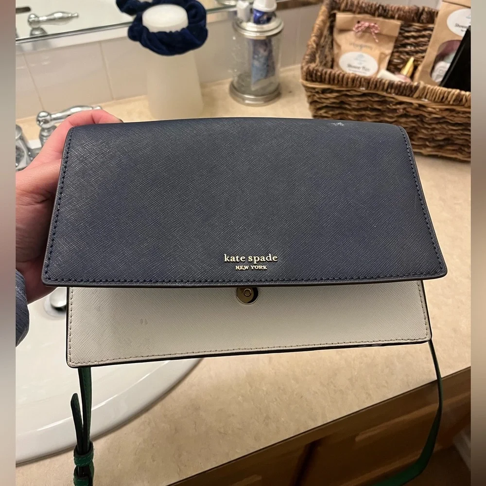 Used Kate spade bag. Navy blue white and green.